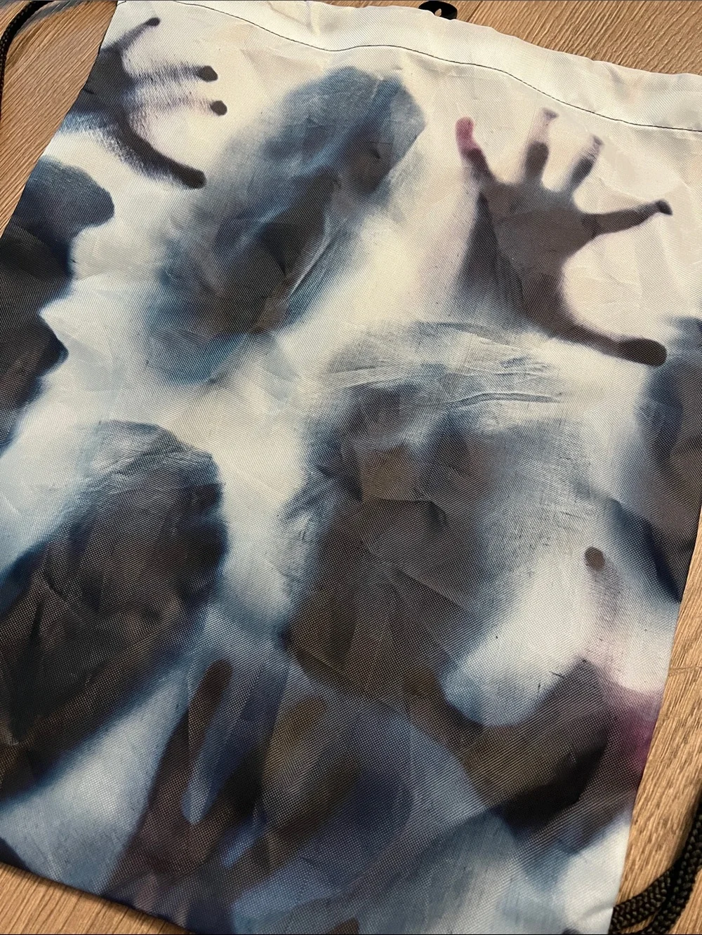Men's Drawstring Halloween Spooky Backpack with Blue and Black Handprint Design